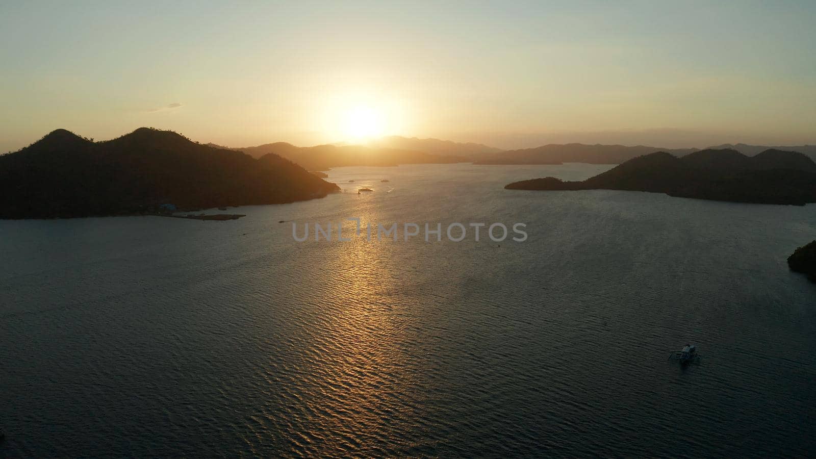 aerial view Sea bay with boats at sunset. Sunset over the sea with islands. Philippine Islands in the evening. Busuanga, Palawan, Philippines