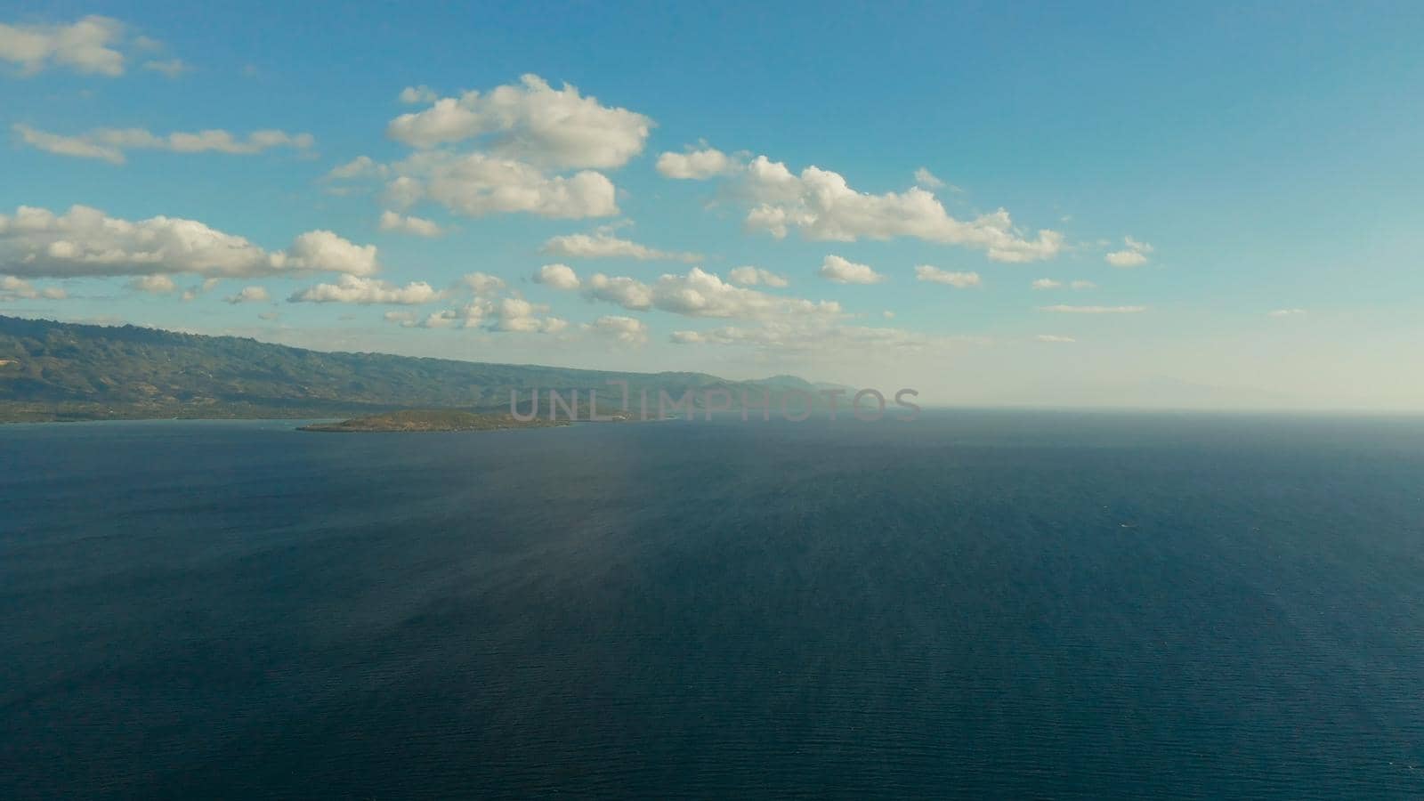 Cloud scape: Blue sky with clouds over the sea and islands, aerial view. Seascape: Ocean and sky, Cebu, Philippines.