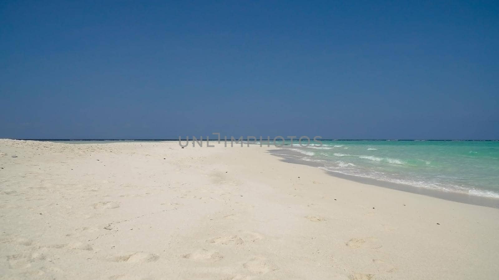 Tropical beach with white sand with beach house on a tropical island. Beautiful sky, sea. Seascape: Ocean and beautiful beach paradise. Philippines. Travel concept.