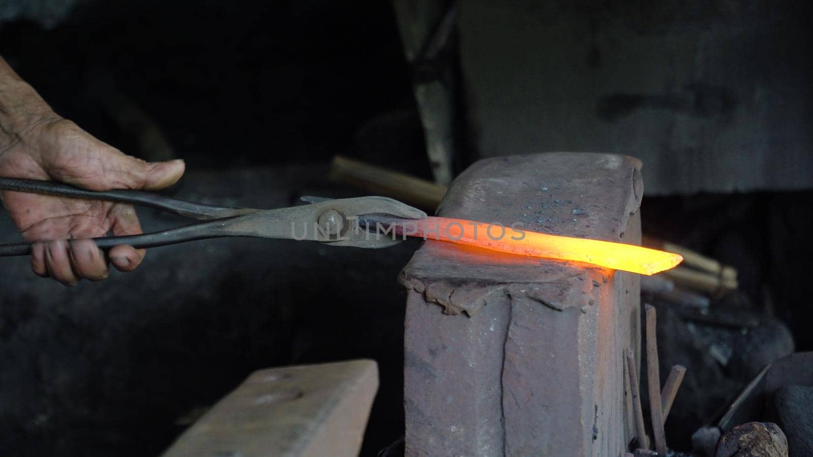Hot metal is processed on the anvil in the forge. Anvil in the forge