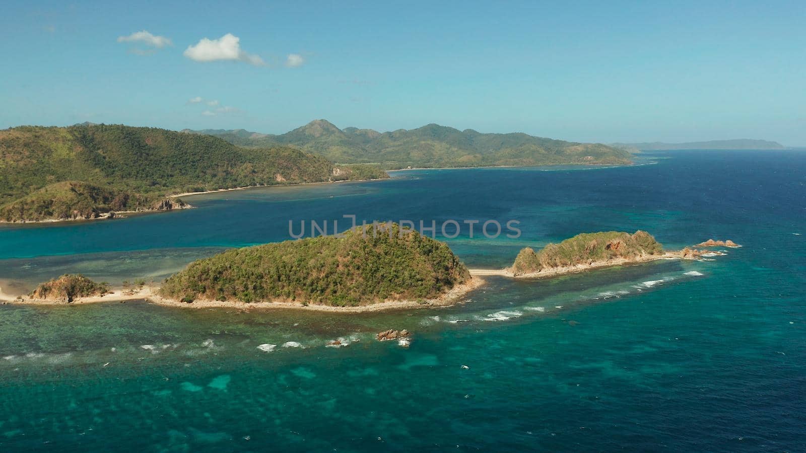 aerial view tropical island in blue lagoon, coral reef and big wave. Palawan, Philippines. tropical landscape ,travel concept