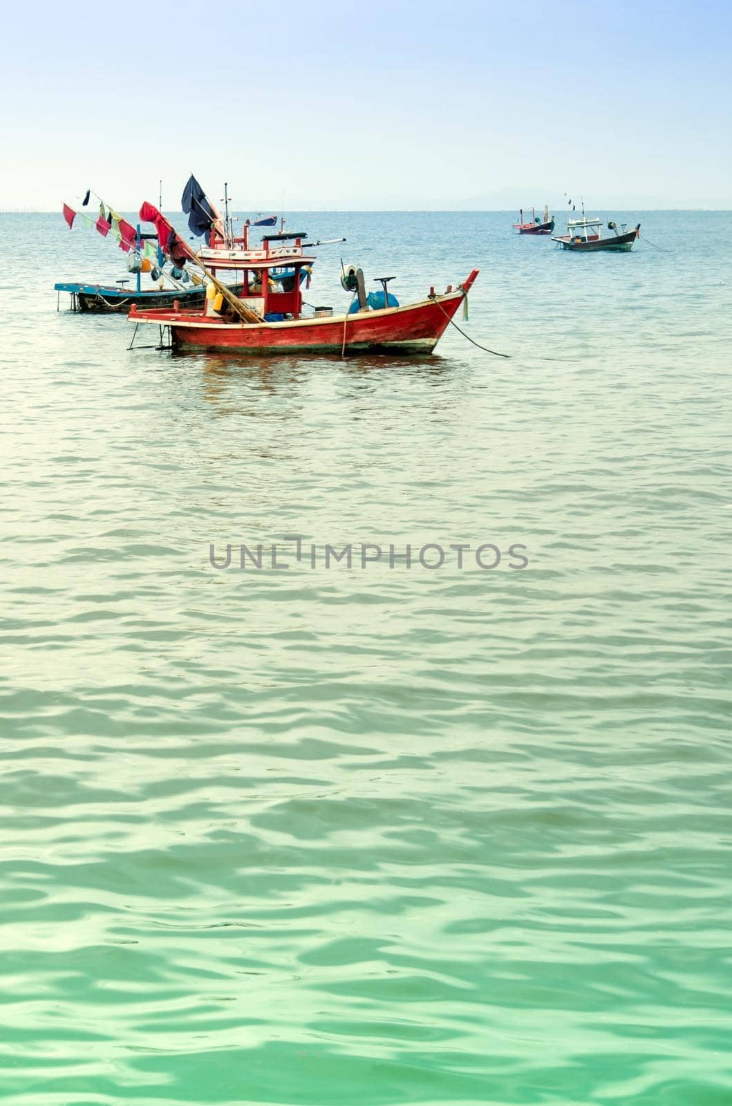 Small Fishing Boats coastal drift after returning from fishing by Satakorn