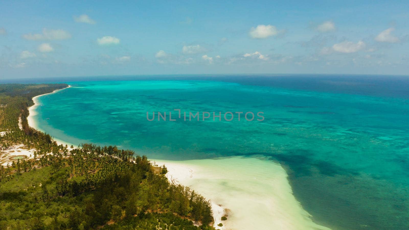 Travel concept: blue sea and sand beach on a tropical island. Punta Sebaring, Balabac, Palawan. Summer and travel vacation concept.