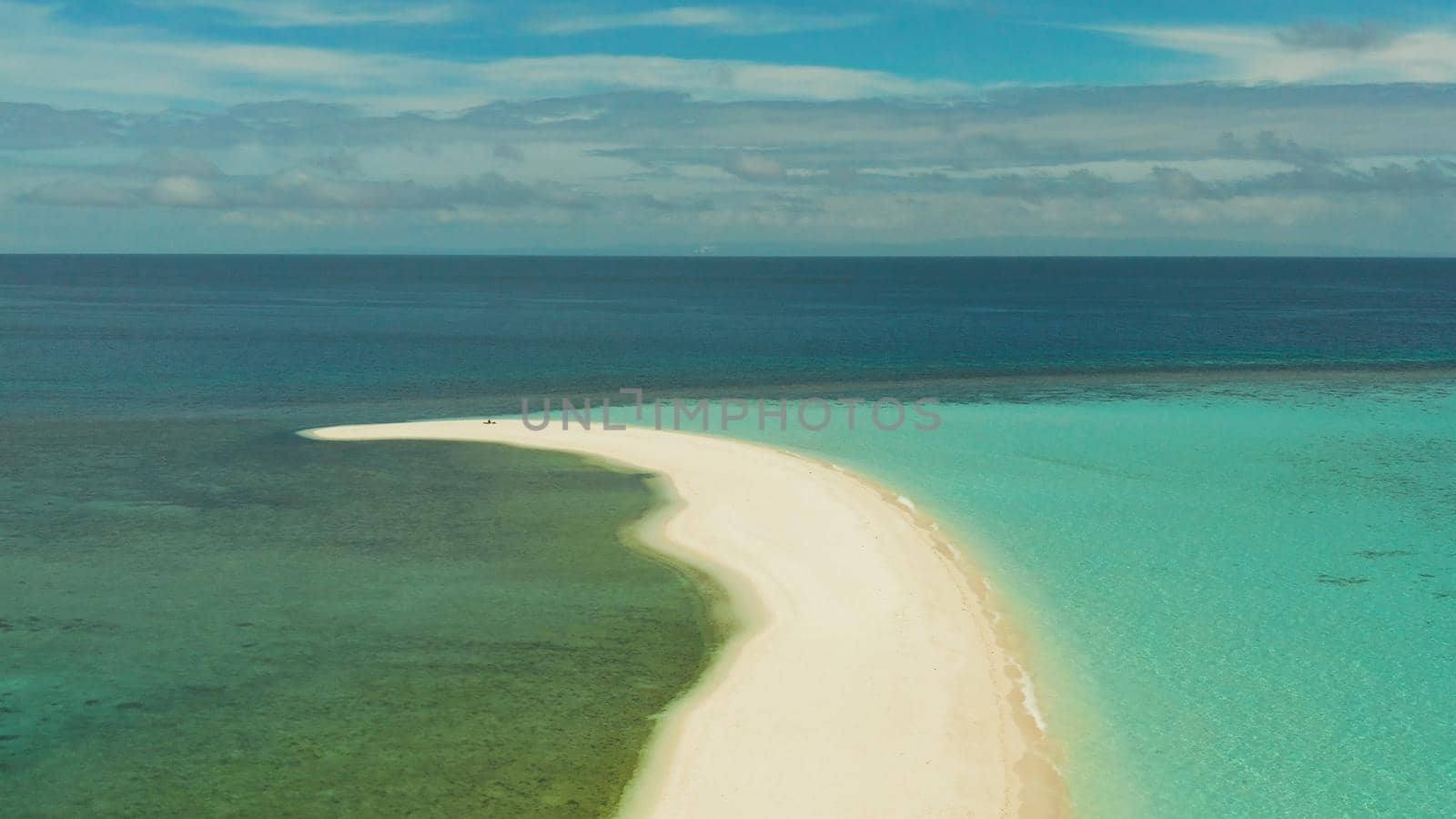 Sandy white island with beach and sandy bar in the turquoise atoll water, aerial drone. Sandbar Atoll. Tropical island and coral reef. Summer and travel vacation concept, Camiguin, Philippines.