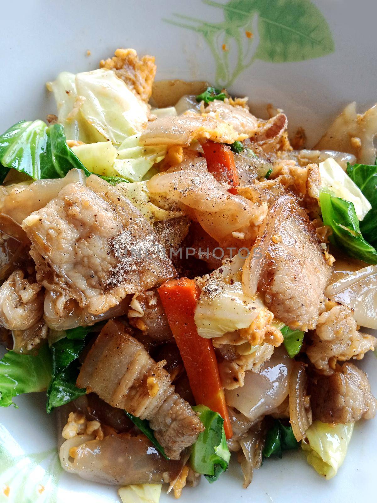 Pad Thai with 3 layers of pork, delicious in Thai style.