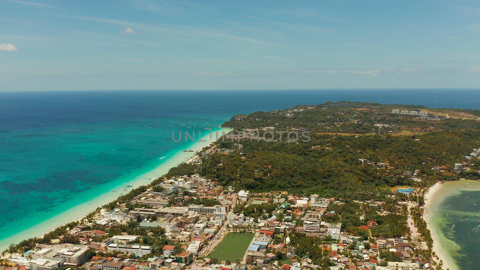 Costline of the tropical island of Boracay with sandy beaches and hotels from above. Summer and travel vacation concept. Philippines.