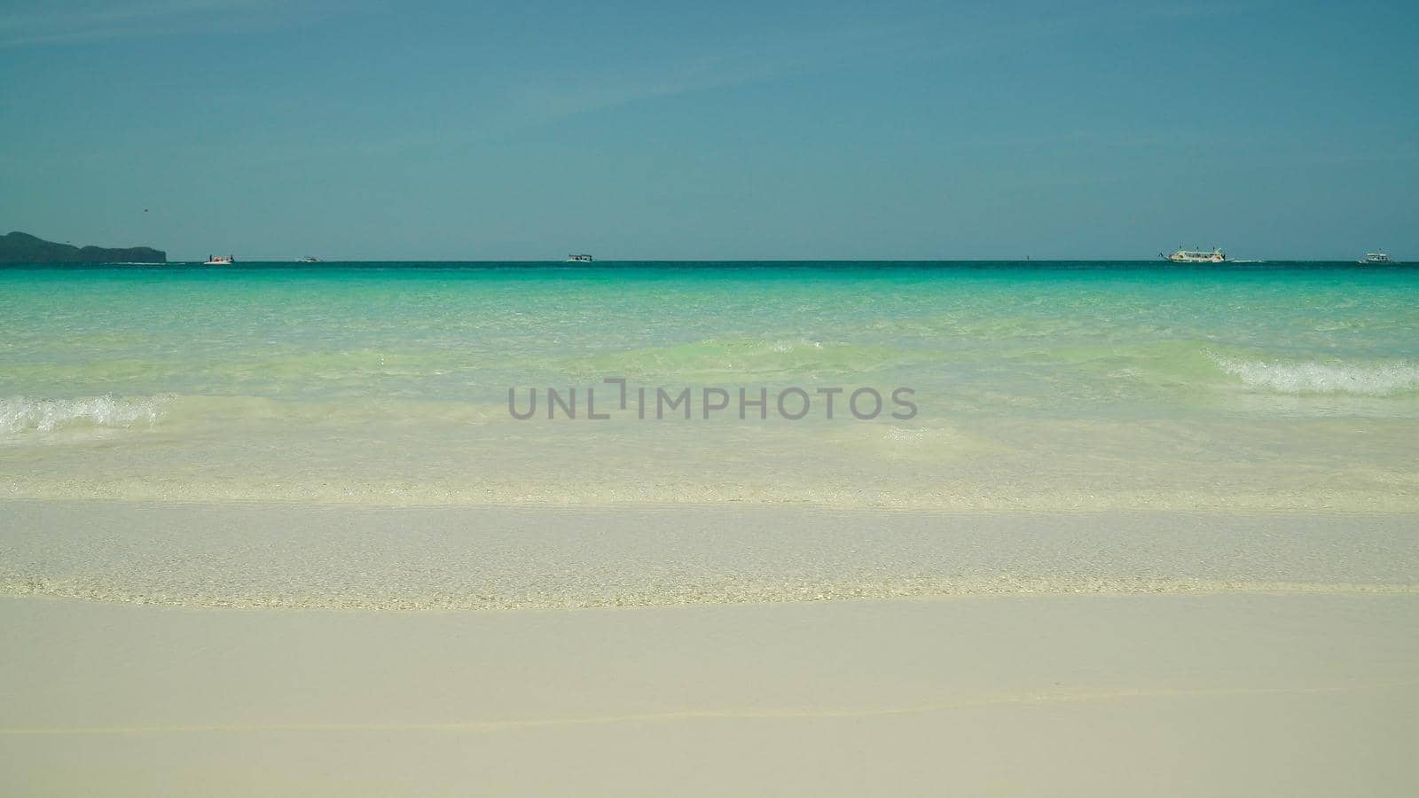 Sandy tropical beach and blue sea against the sky. Boracay, Philippines. Summer and travel vacation concept. Boracay, Philippines