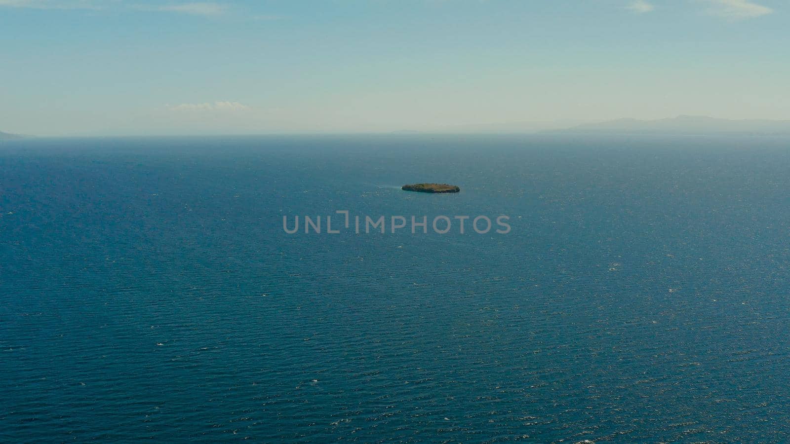 Blue sea surface and tropical islands Pescador, top view. Blue sea surface with waves. Moalboal, Philippines