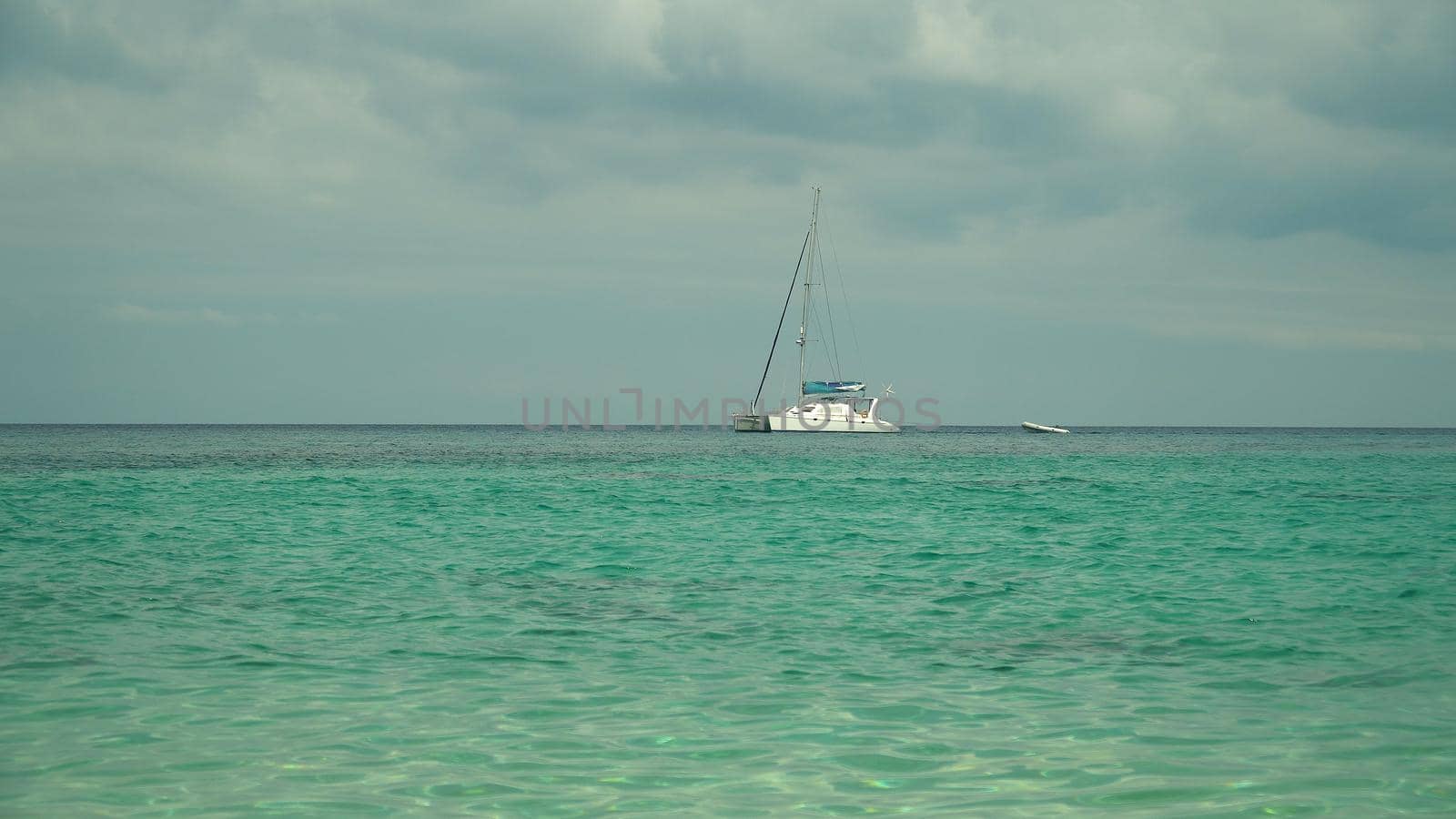 Motor Luxury yacht in the sea against the sky and clouds.
