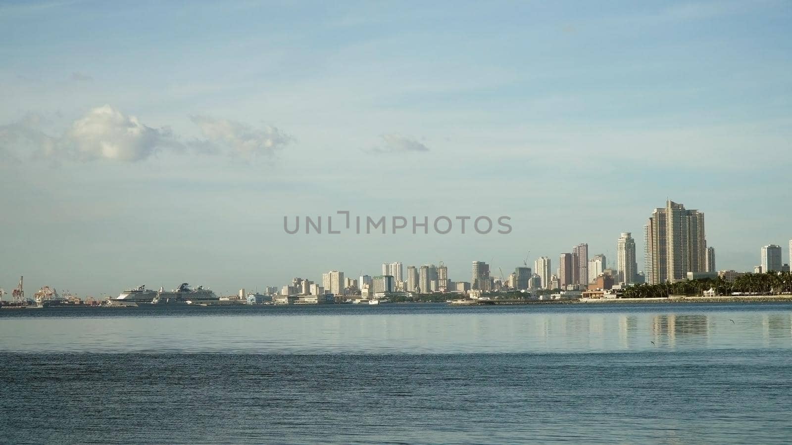 Manila city, skyscrapers and buildings. Seascape coastal city of Manila. Modern city by sea. Makati district. Travel concept.