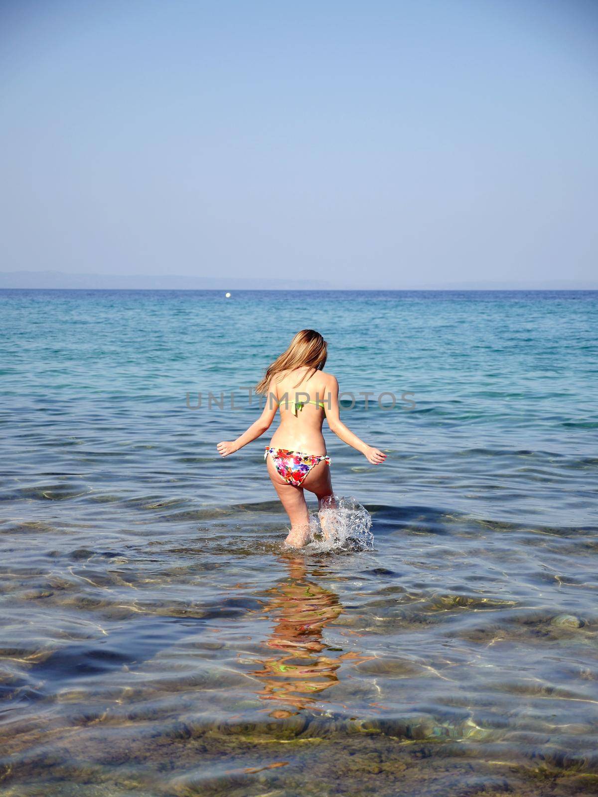 long woman play on the blue sea