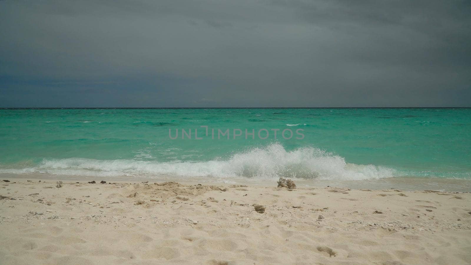 Sandy tropical beach and blue sea. Summer and travel vacation concept.