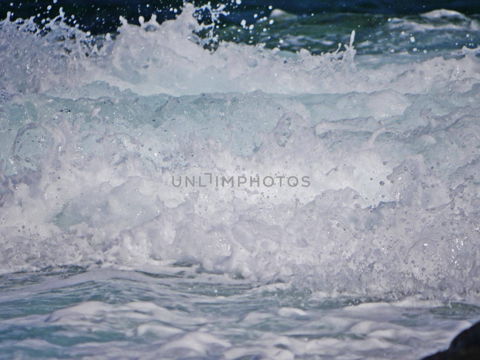 Waves crashing against the rock, natural landscape