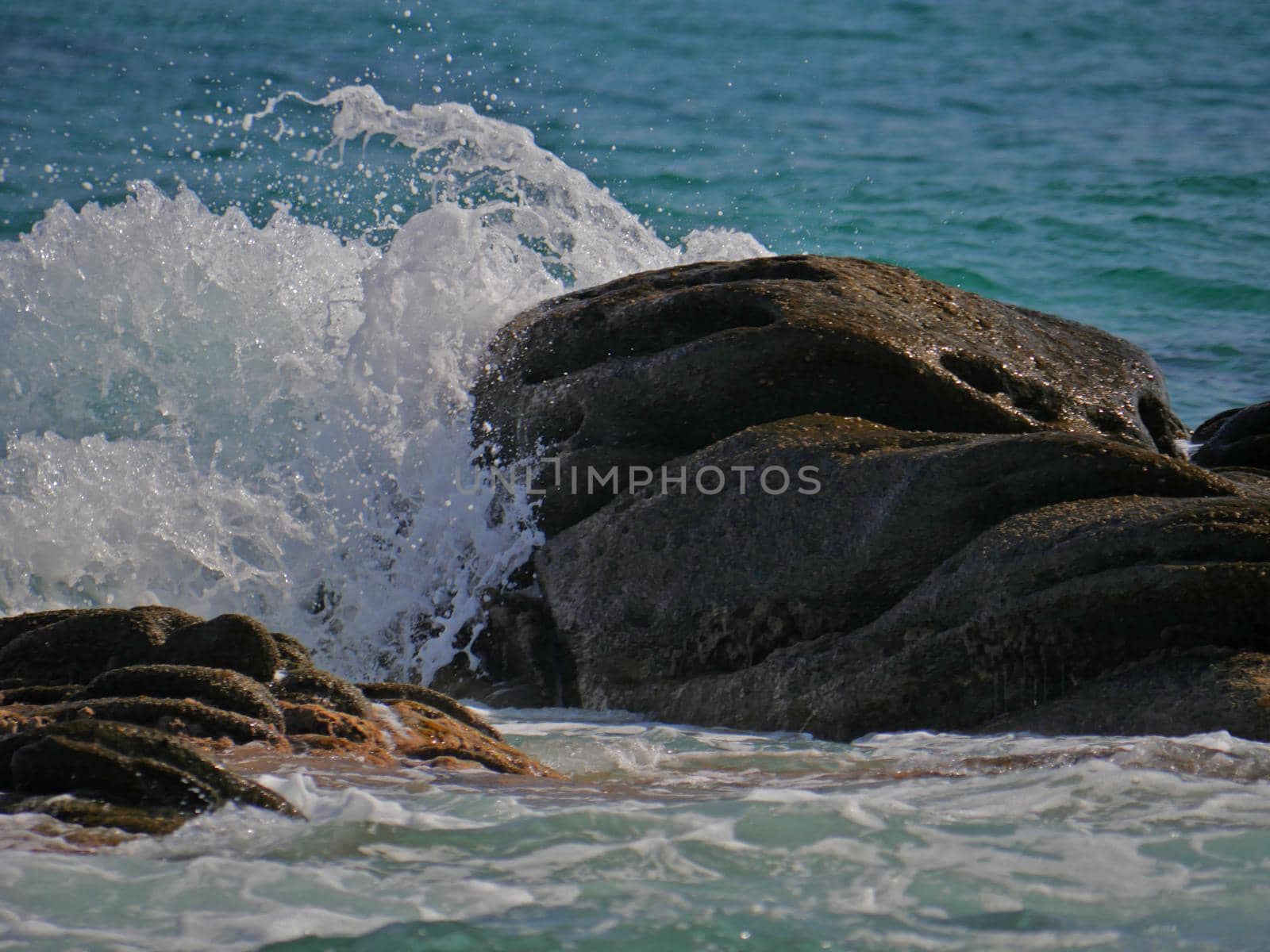 Waves crashing against the rock, natural landscape