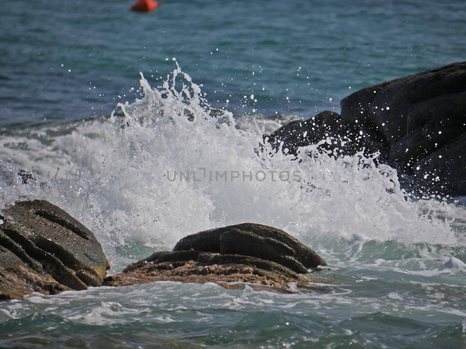 Waves crashing against the rock, natural landscape