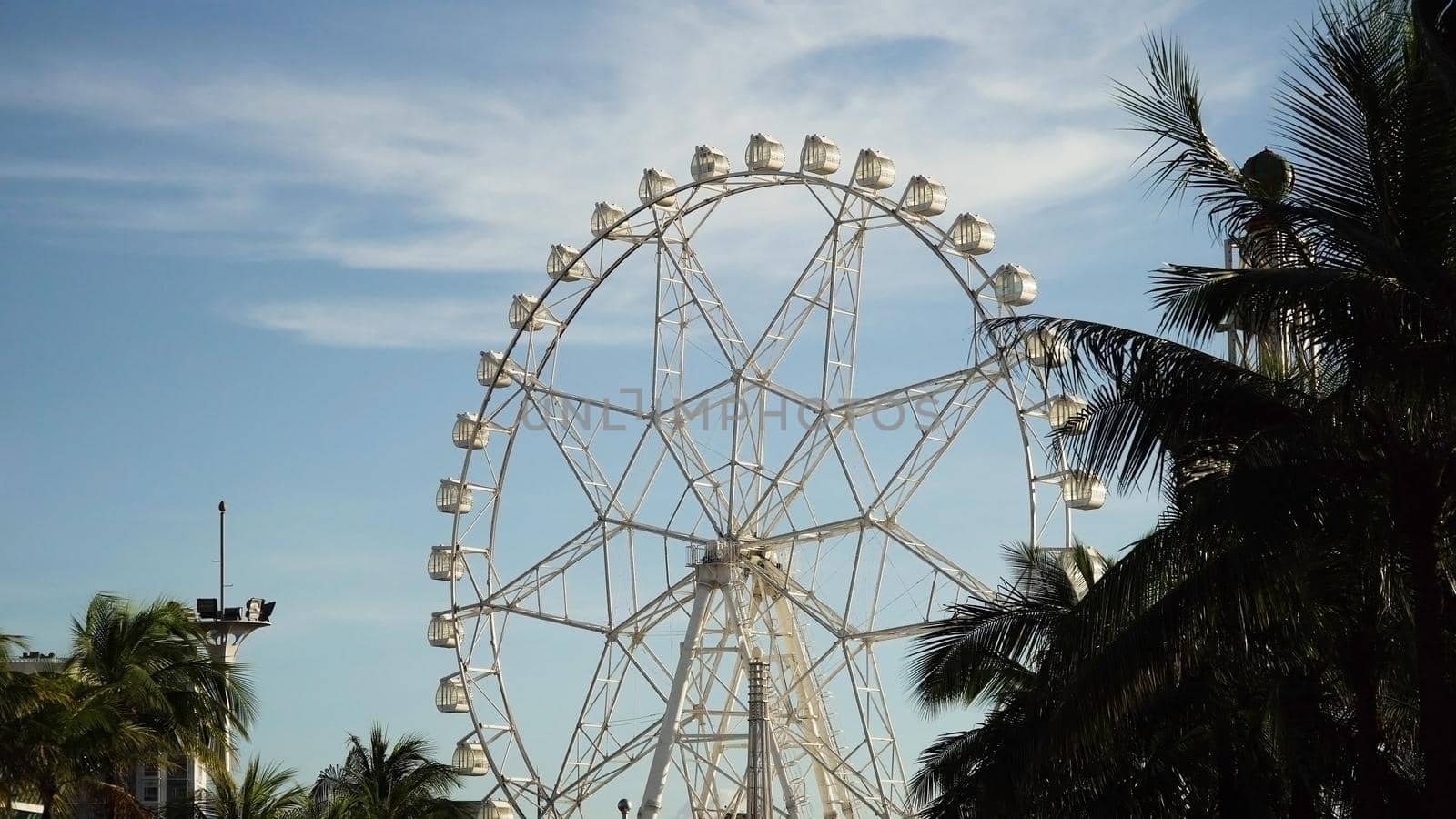 Ferris wheel in Manila, Mall of Asia. Ferris wheel against a blue sky. Philippines.