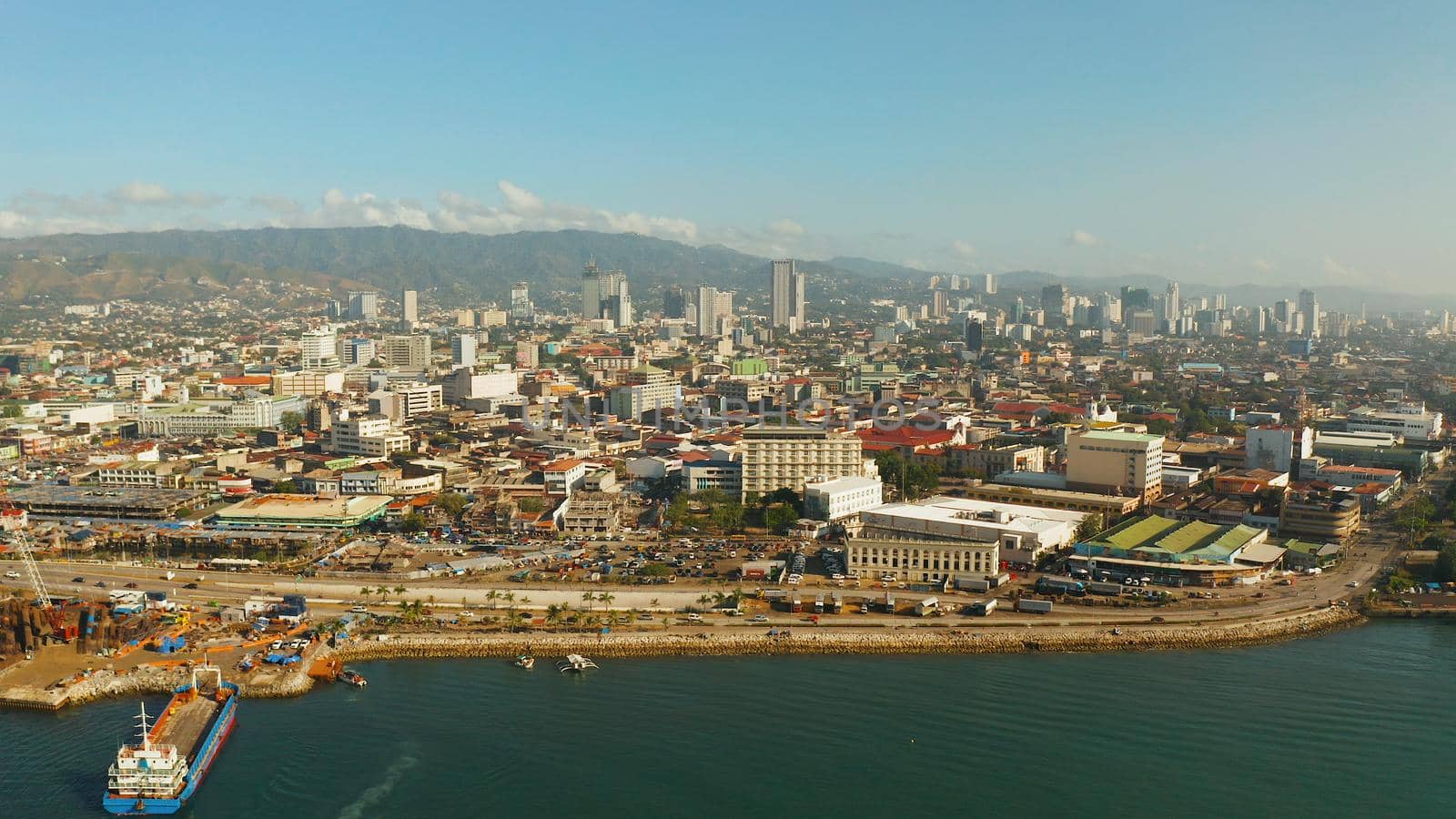 Cityscape: Cebu city with modern buildings, skyscrapers and business centers, top view during sunrise. Philippines.
