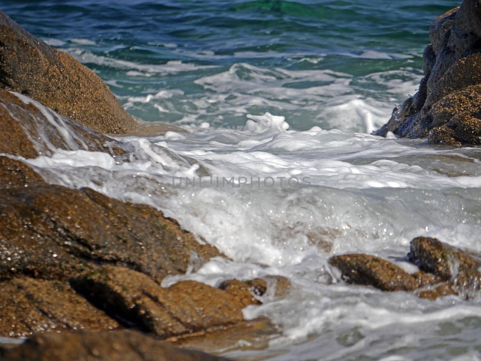 Waves crashing against the rock, natural background