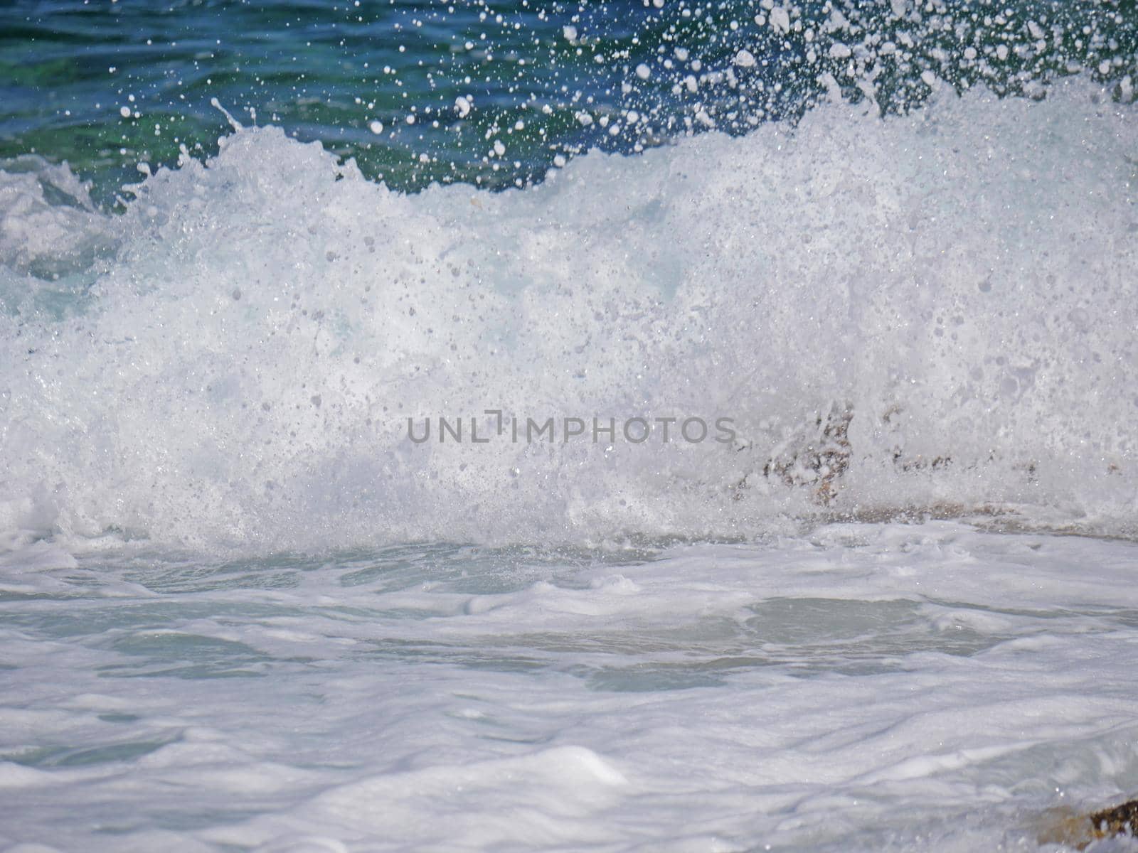 Waves crashing against the rock, natural background