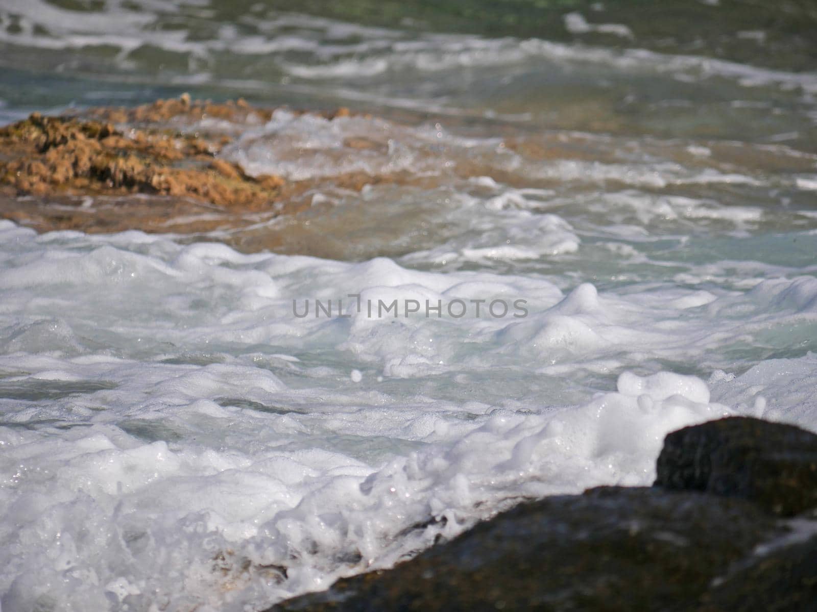 Waves crashing against the rock, natural background