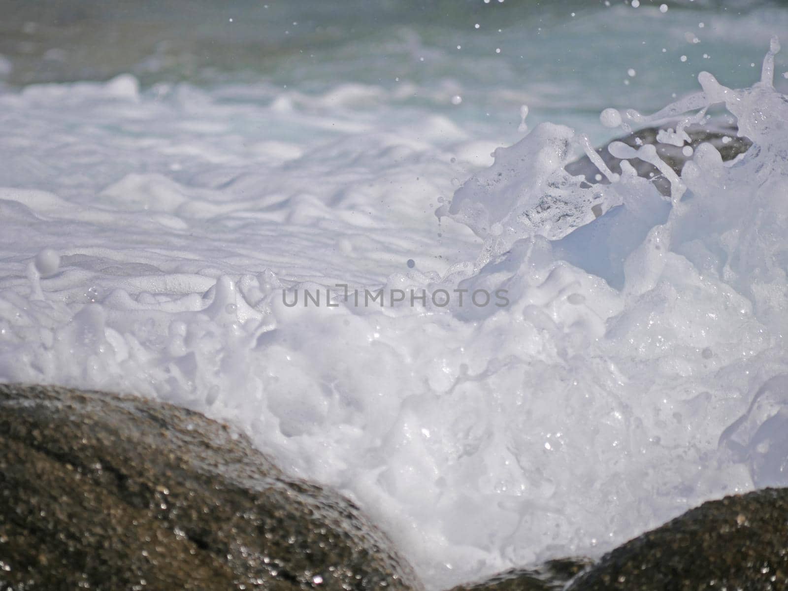 Waves crashing against the rock, natural background