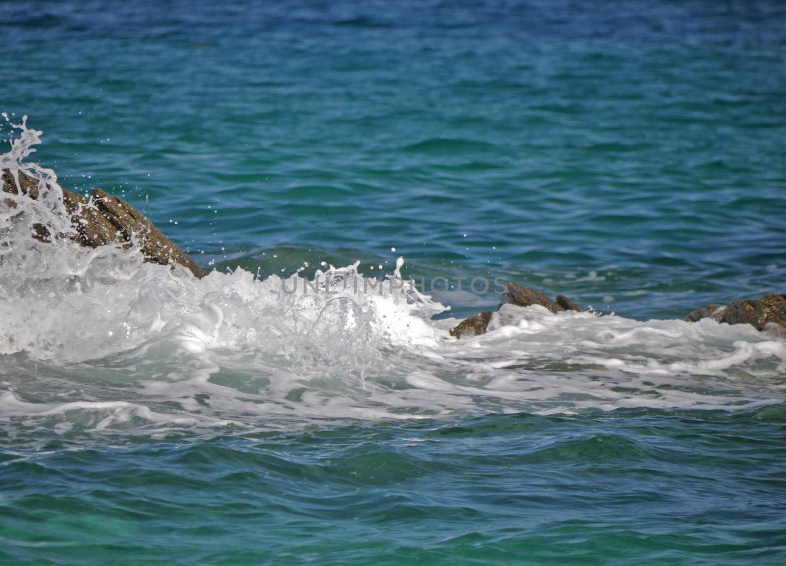 Waves crashing against the rock, natural background