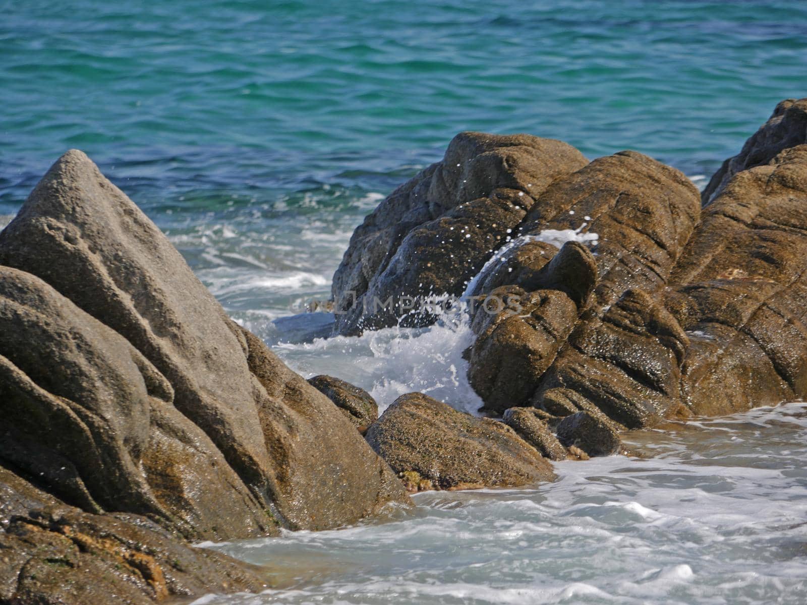 Waves crashing against the rock, natural background