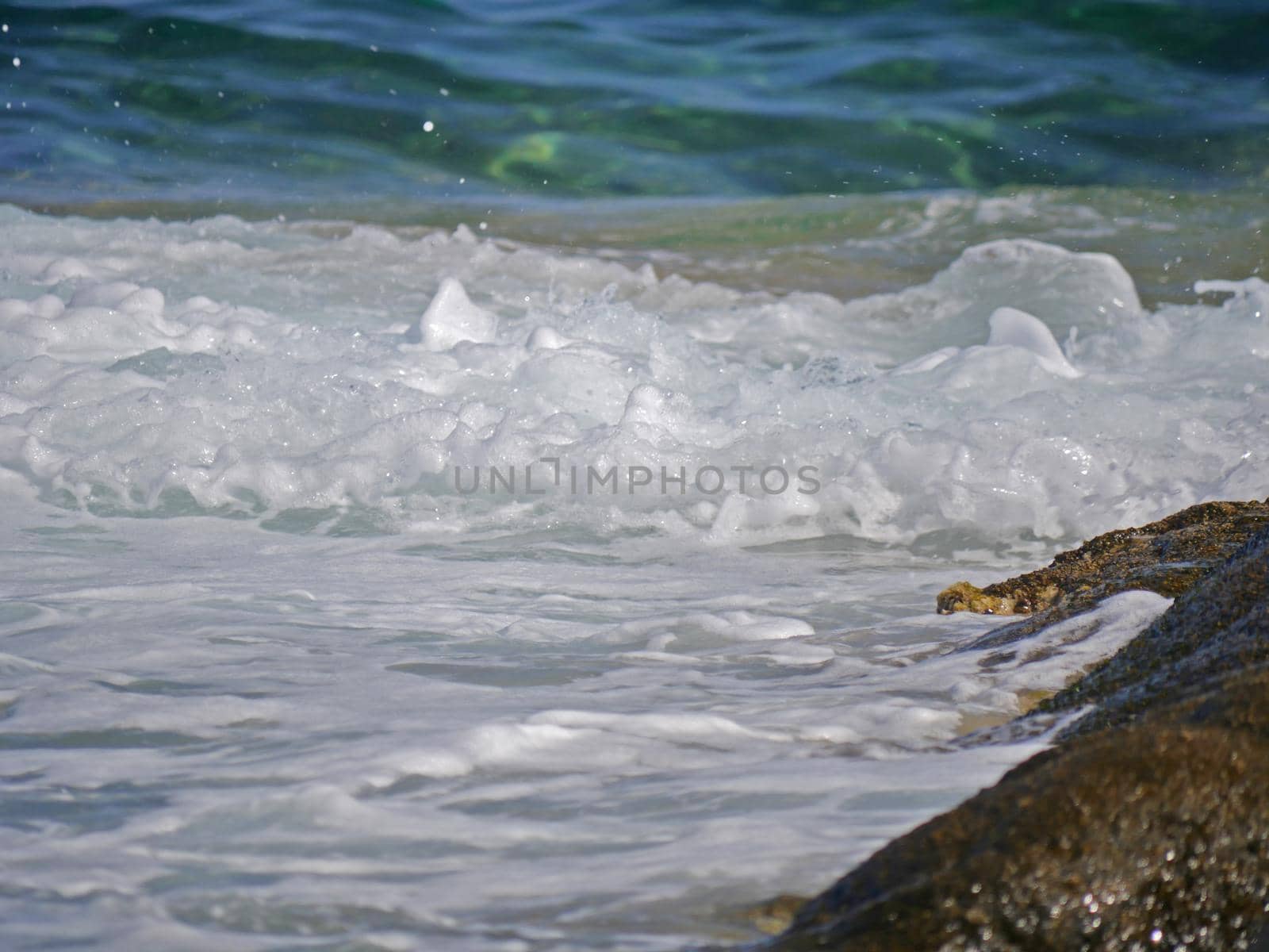 Waves crashing against the rock, natural background