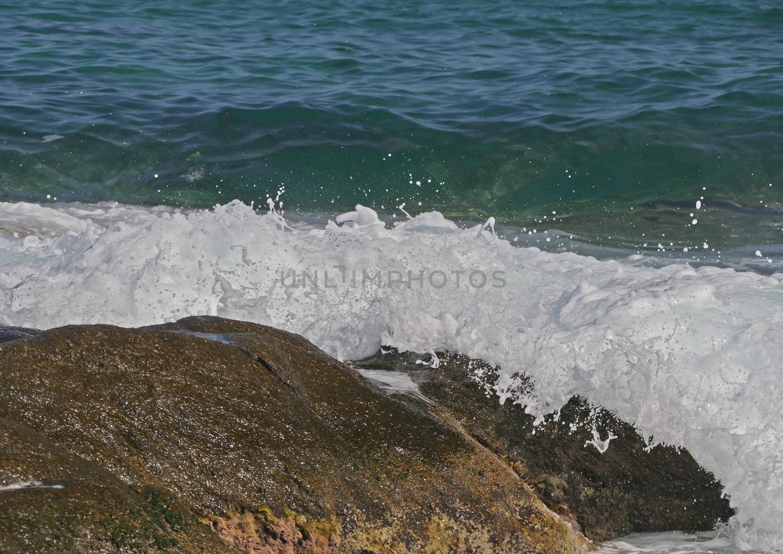 Waves crashing against the rock, natural background