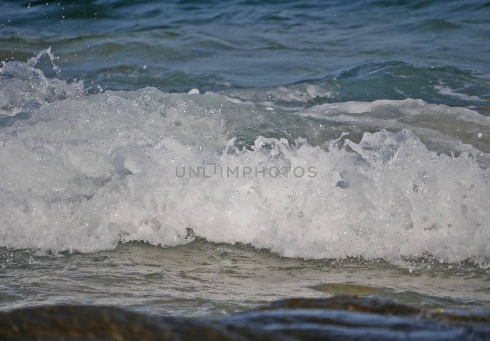 Waves crashing against the rock, natural background