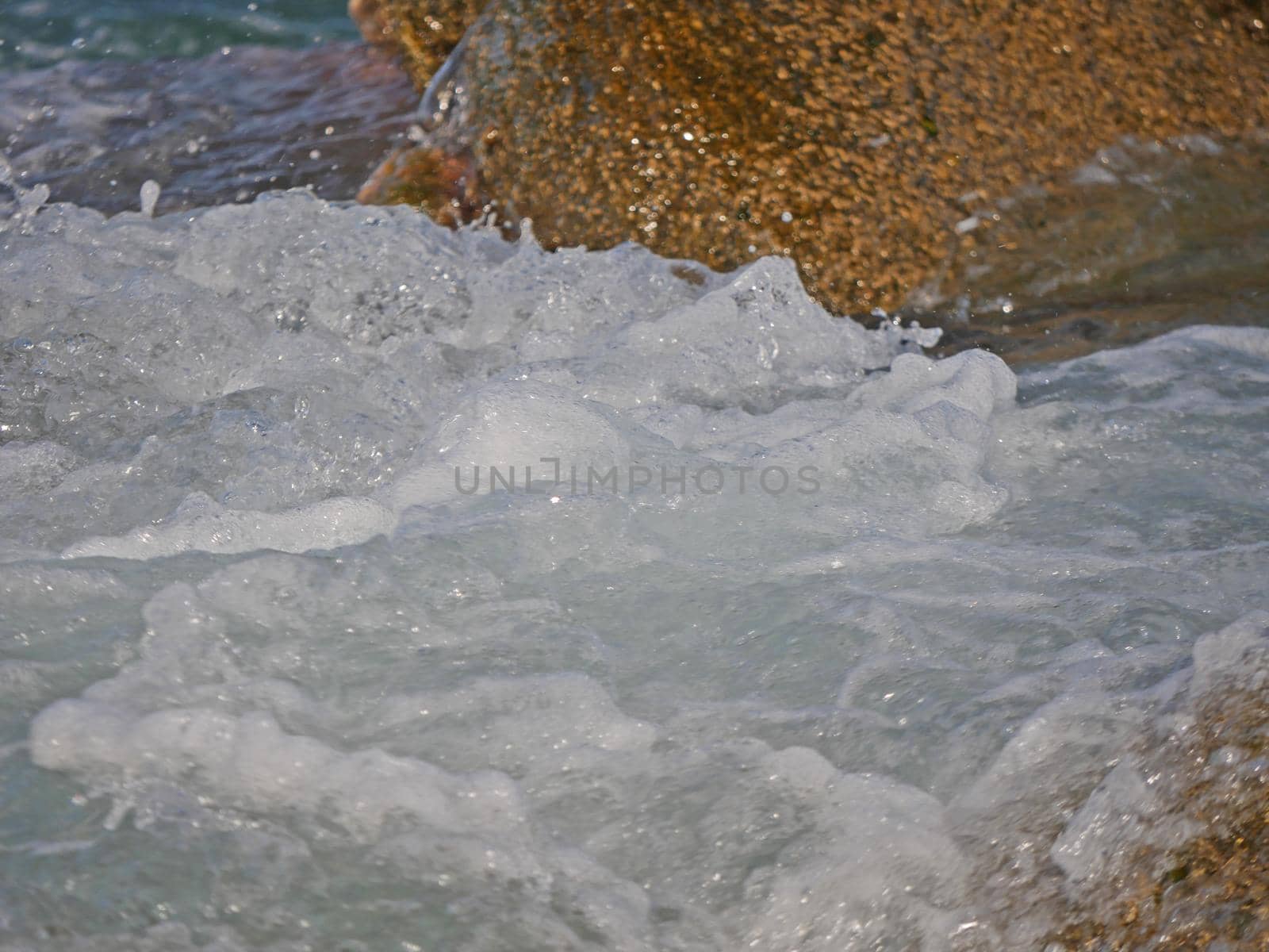 Waves crashing against the rock, natural background