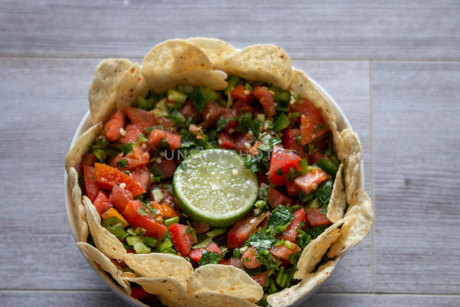 Homemade pico de gallo with a lime center piece . High quality photo