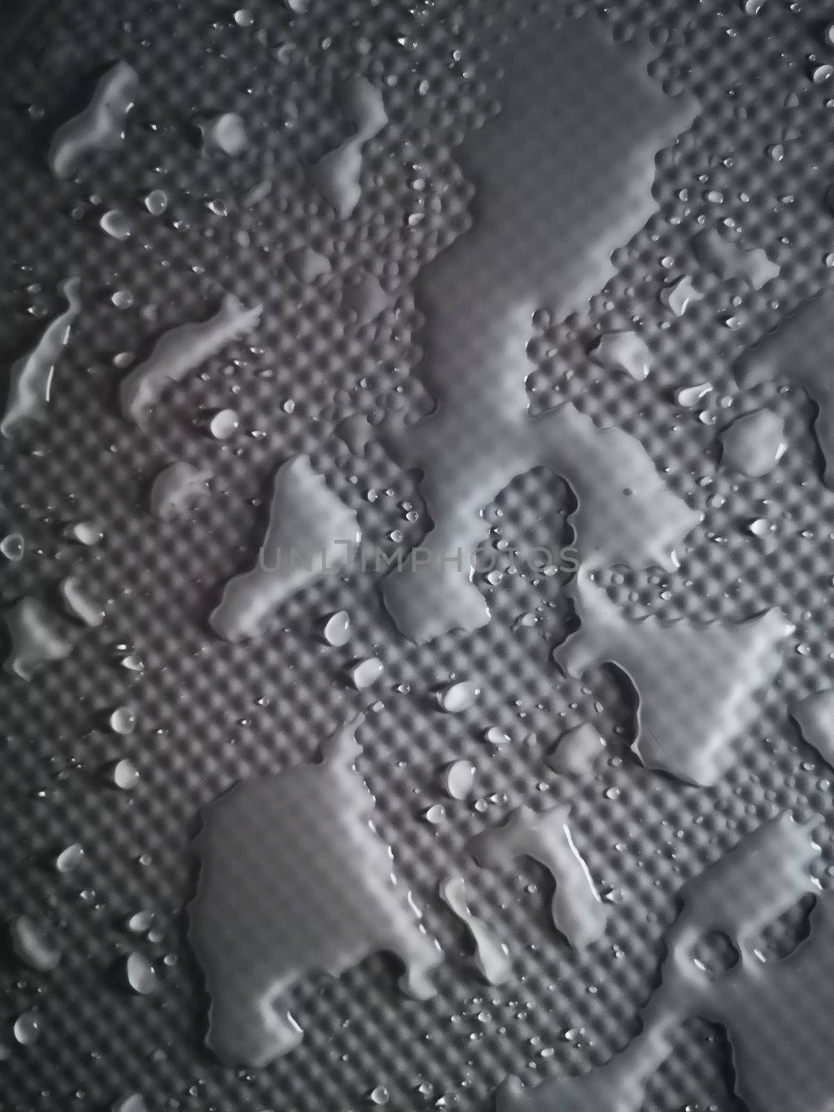 Splashes of water on shower tray highlighted in color 