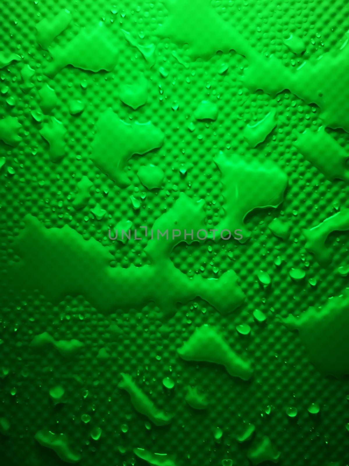 Splashes of water on shower tray highlighted in color 