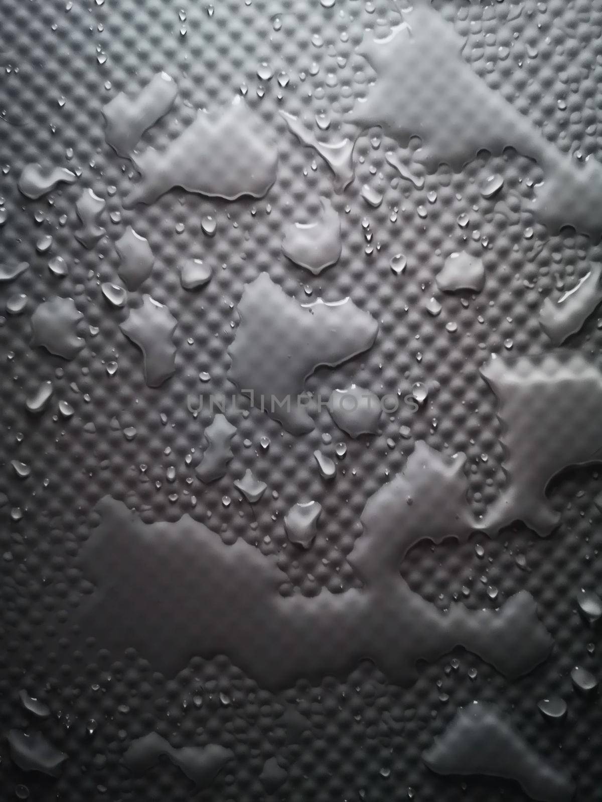 Splashes of water on shower tray highlighted in color 