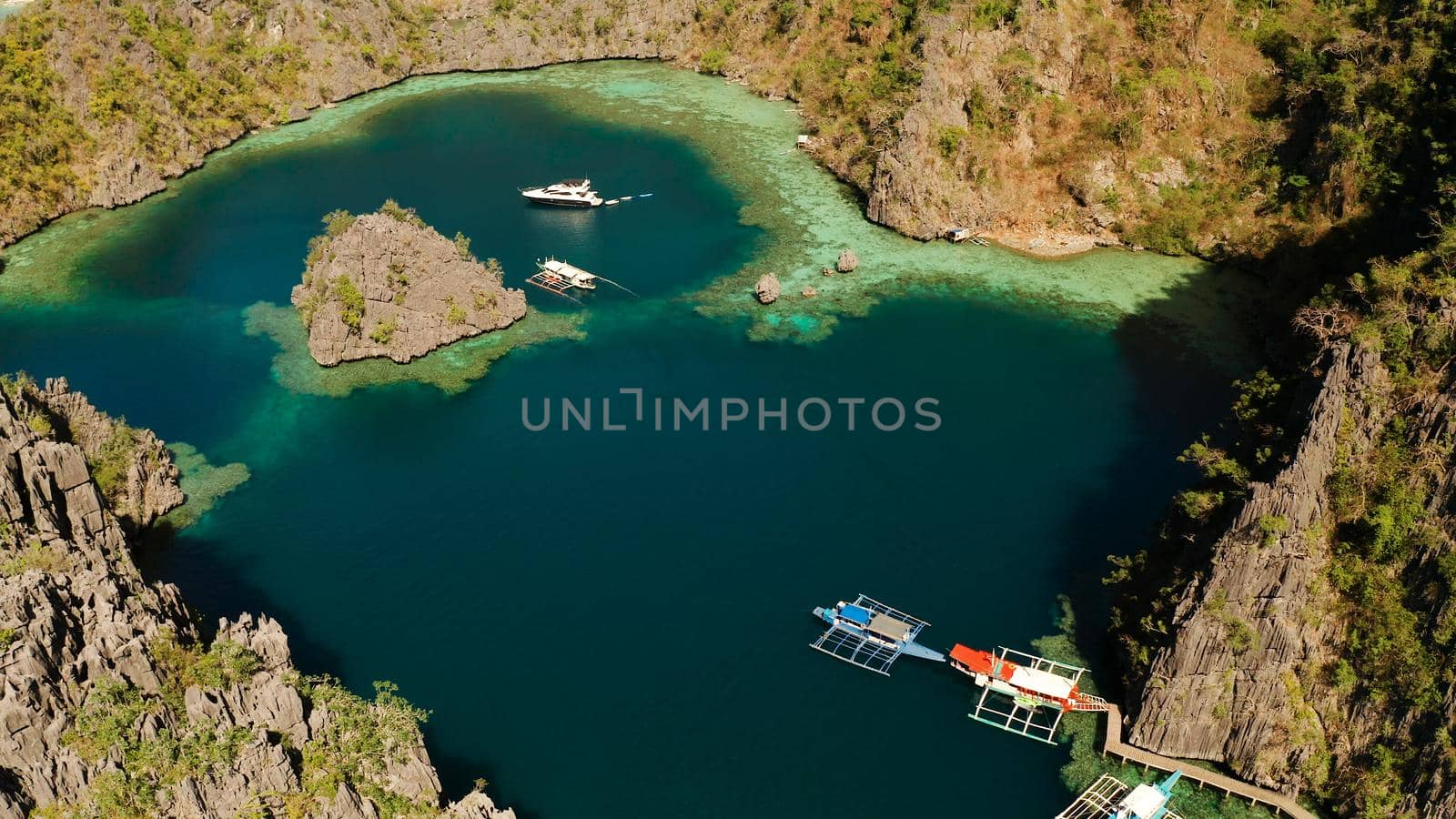 Aerial drone lagoons and coves with blue water among the rocks. lagoon, Kayangan Lake.mountains covered with forests. Seascape, tropical landscape. Palawan, Philippines, Busuanga