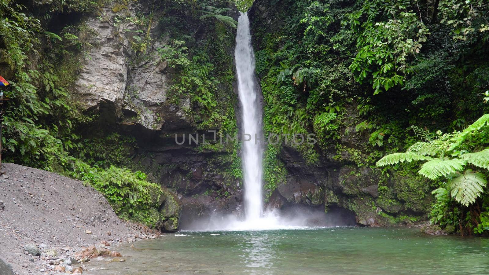 Waterfall in green rainforest. Tropical Tuasan Falls in mountain jungle. waterfall in the tropical forest. Camiguin, Philippines, Mindanao