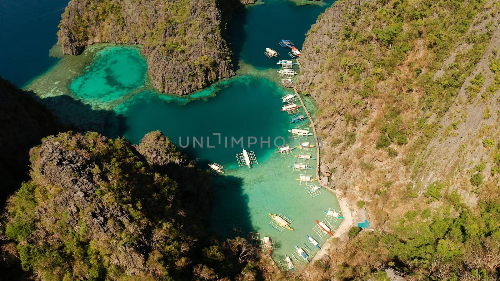 Aerial drone lagoons and coves with blue water among the rocks. lagoon, Kayangan Lake.mountains covered with forests. Seascape, tropical landscape. Palawan, Philippines, Busuanga