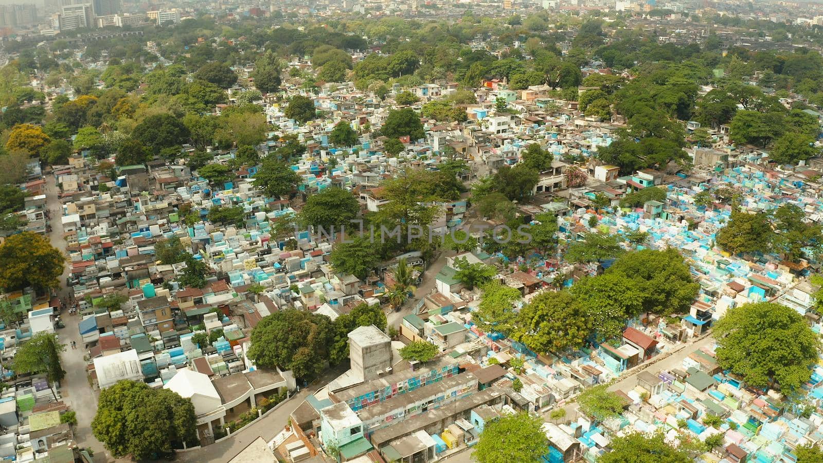 The northern cemetery in Manila with many graves and crypts in the city center aerial view. Travel concept.