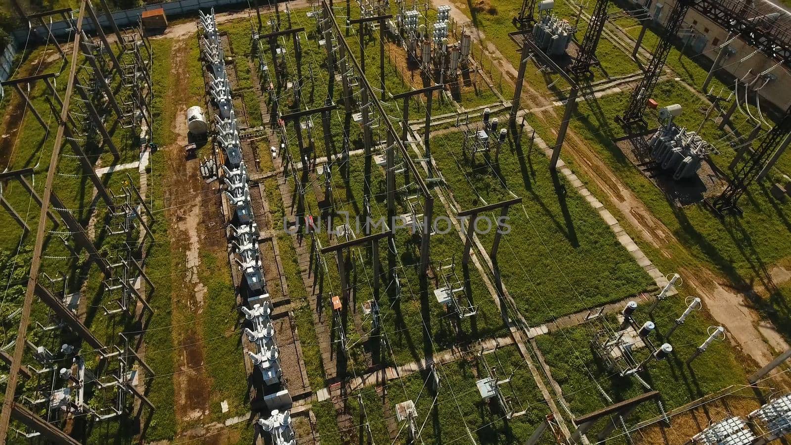 Aerial view Power plant, transformation station, cables and wires. High voltage electric power substation. Electrical power transformer in high voltage substation,