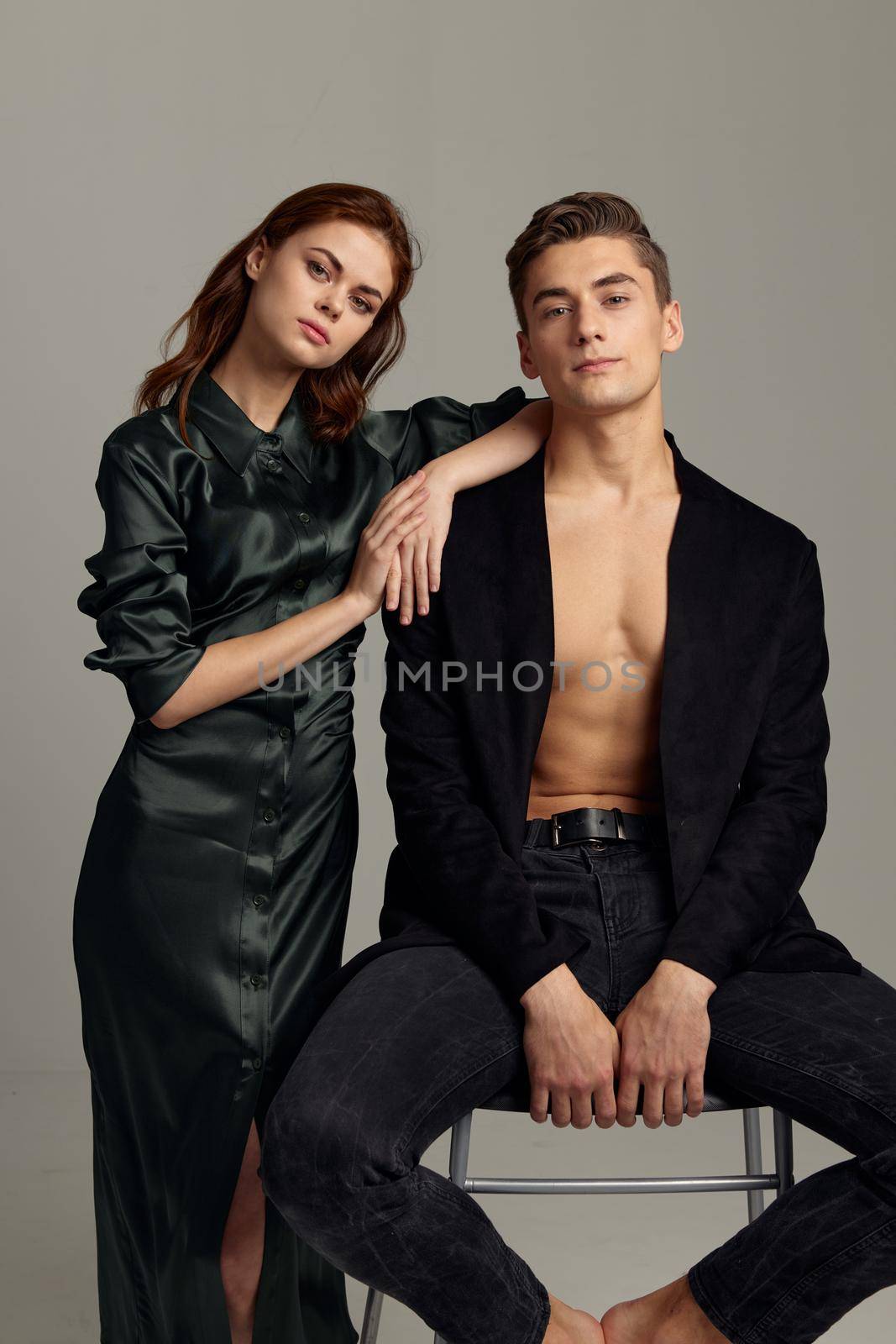 Young couple stands beside portrait luxury intimacy romance by SHOTPRIME