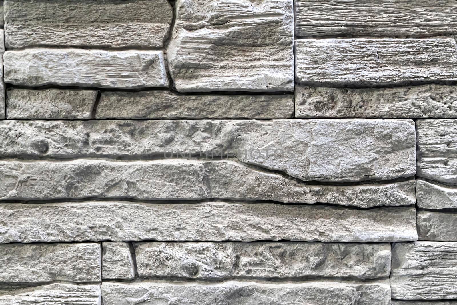 masonry wall paving stones as a background close up