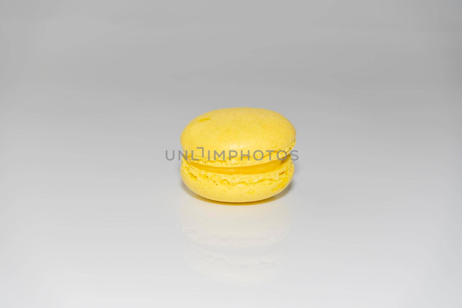 yellow macaroons on a gray background. isolate. High quality photo