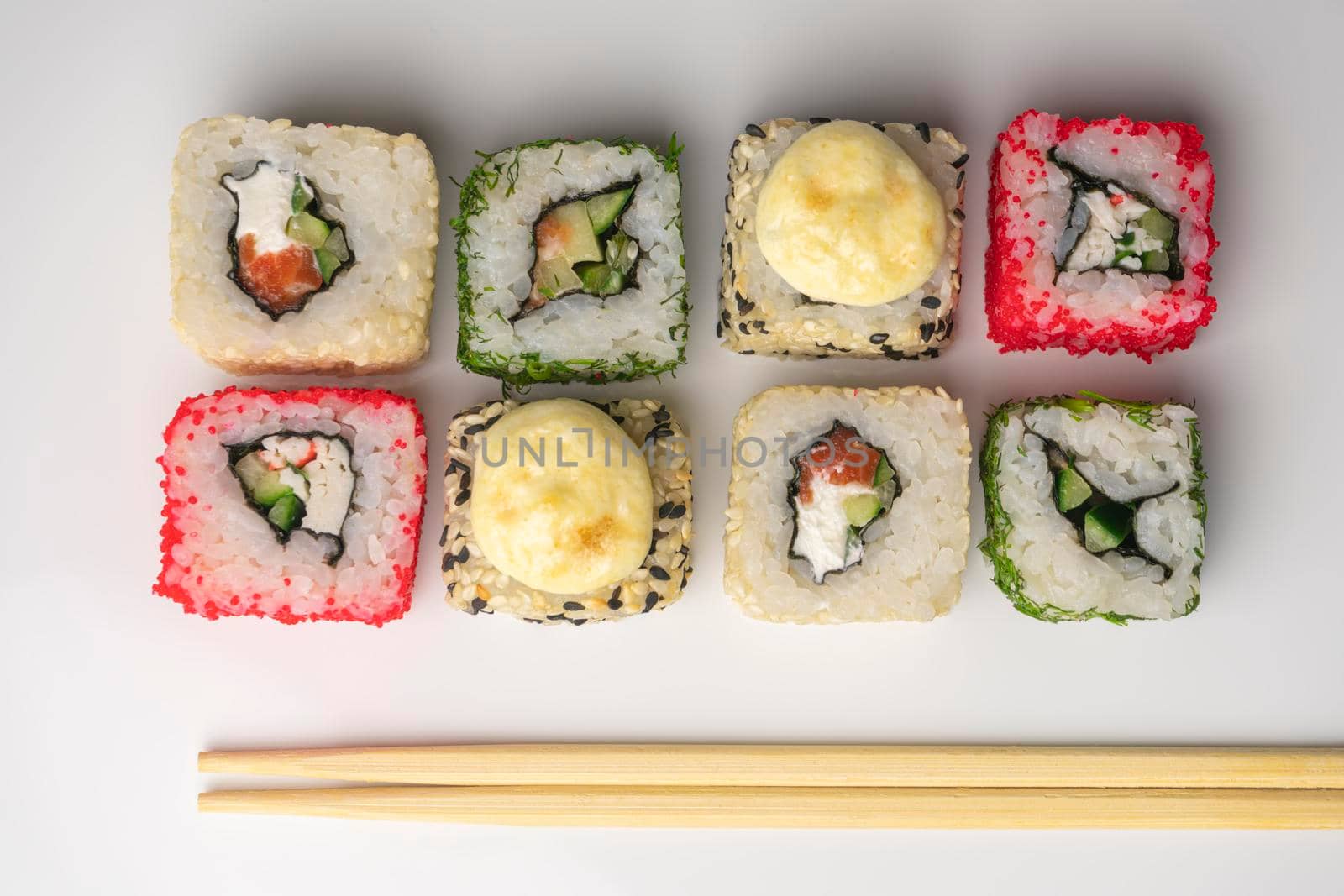 four pieces of sushi on a white background. the view from the top. High quality photo