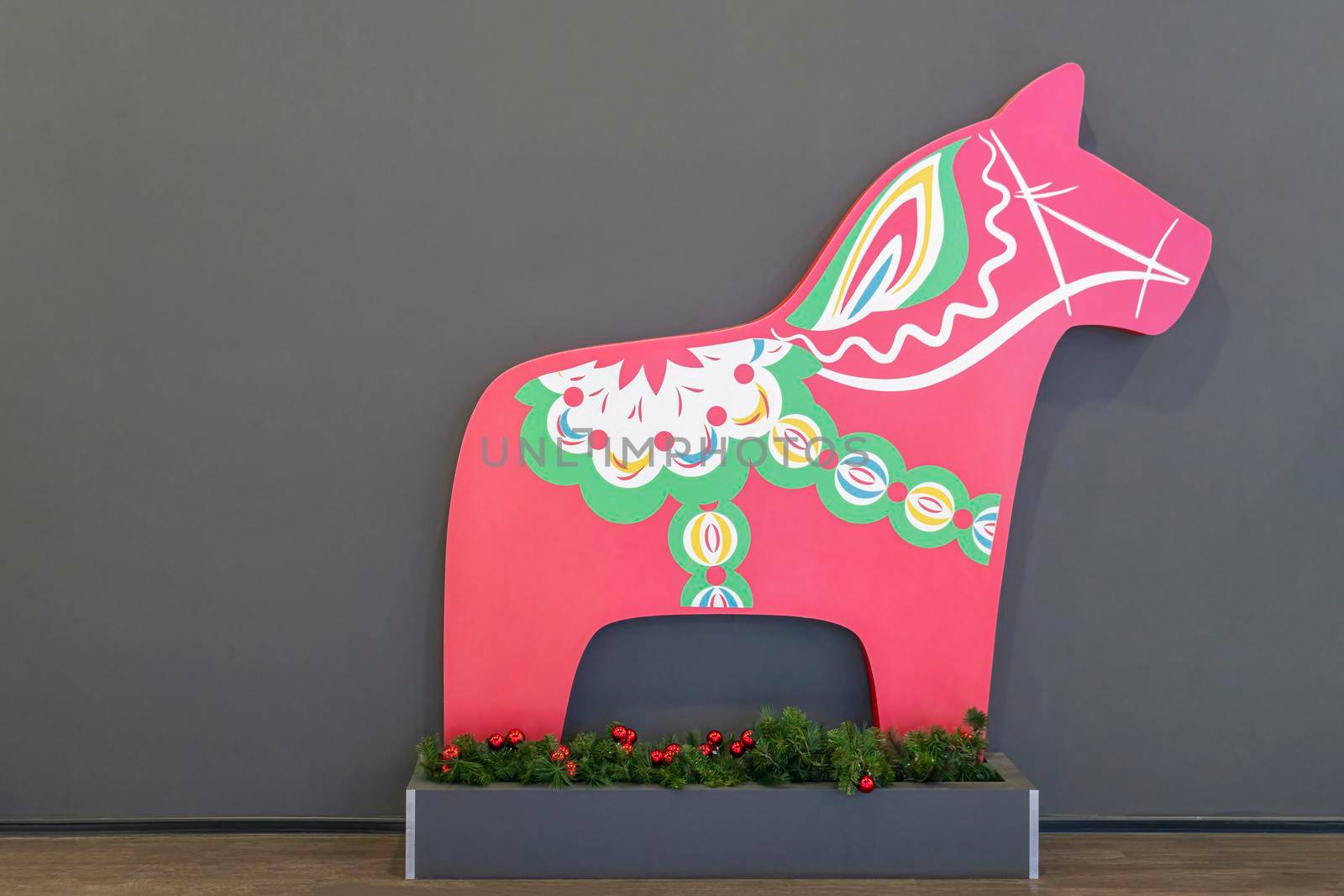 figure of a red horse on a gray background. High quality photo