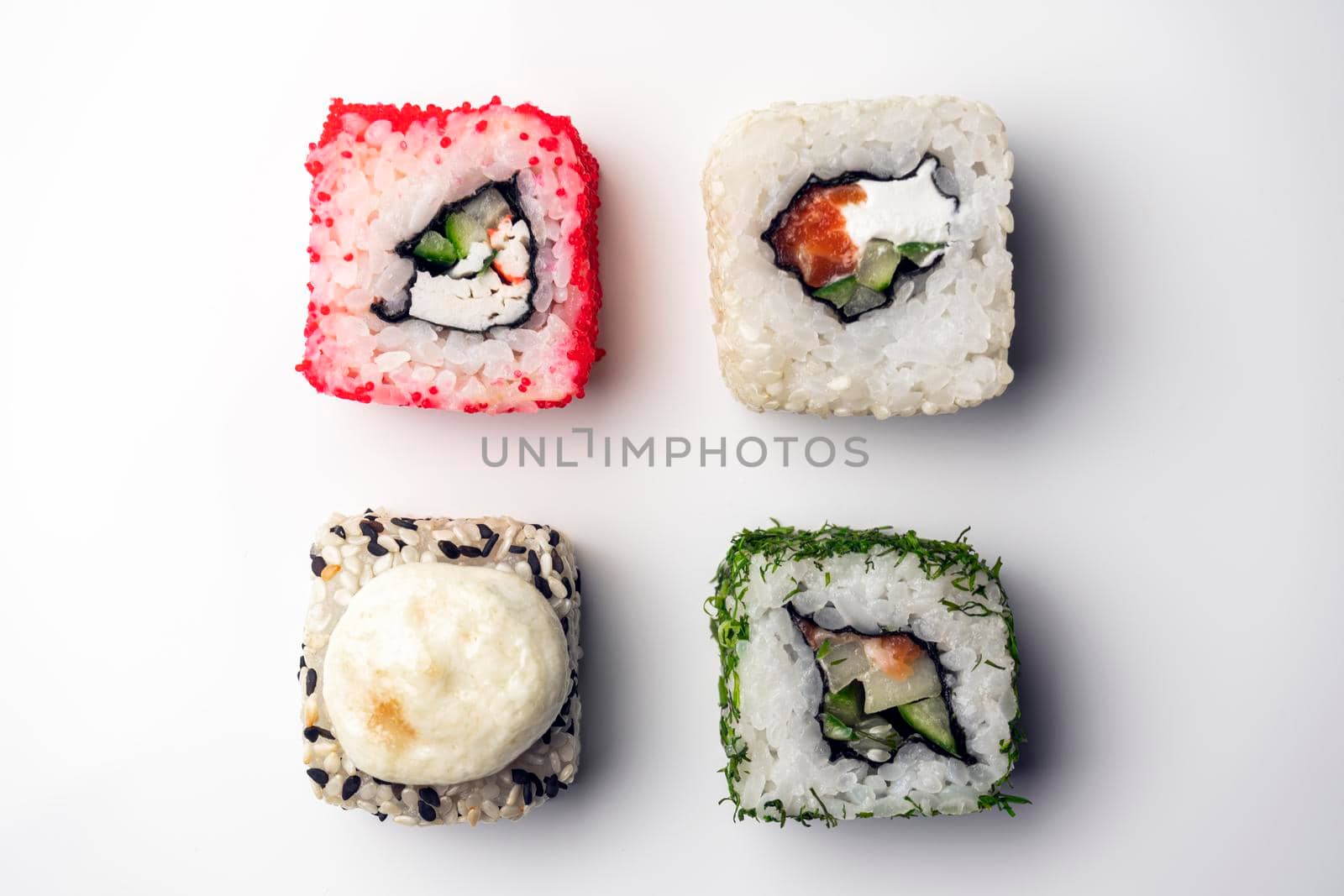 four pieces of sushi on a white background. the view from the top. High quality photo