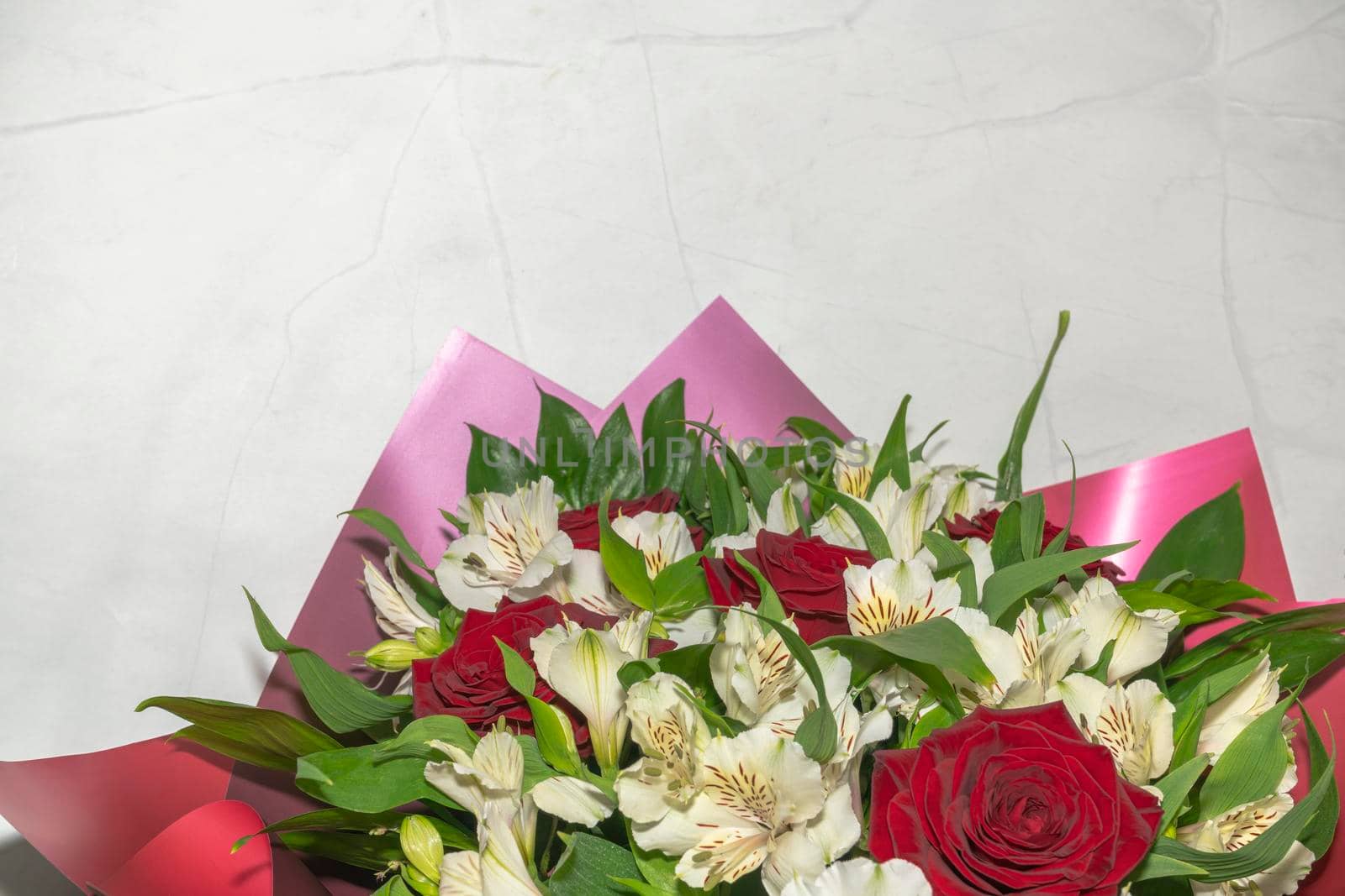 bouquet of red roses and white alstroemeria flowers close up. High quality photo