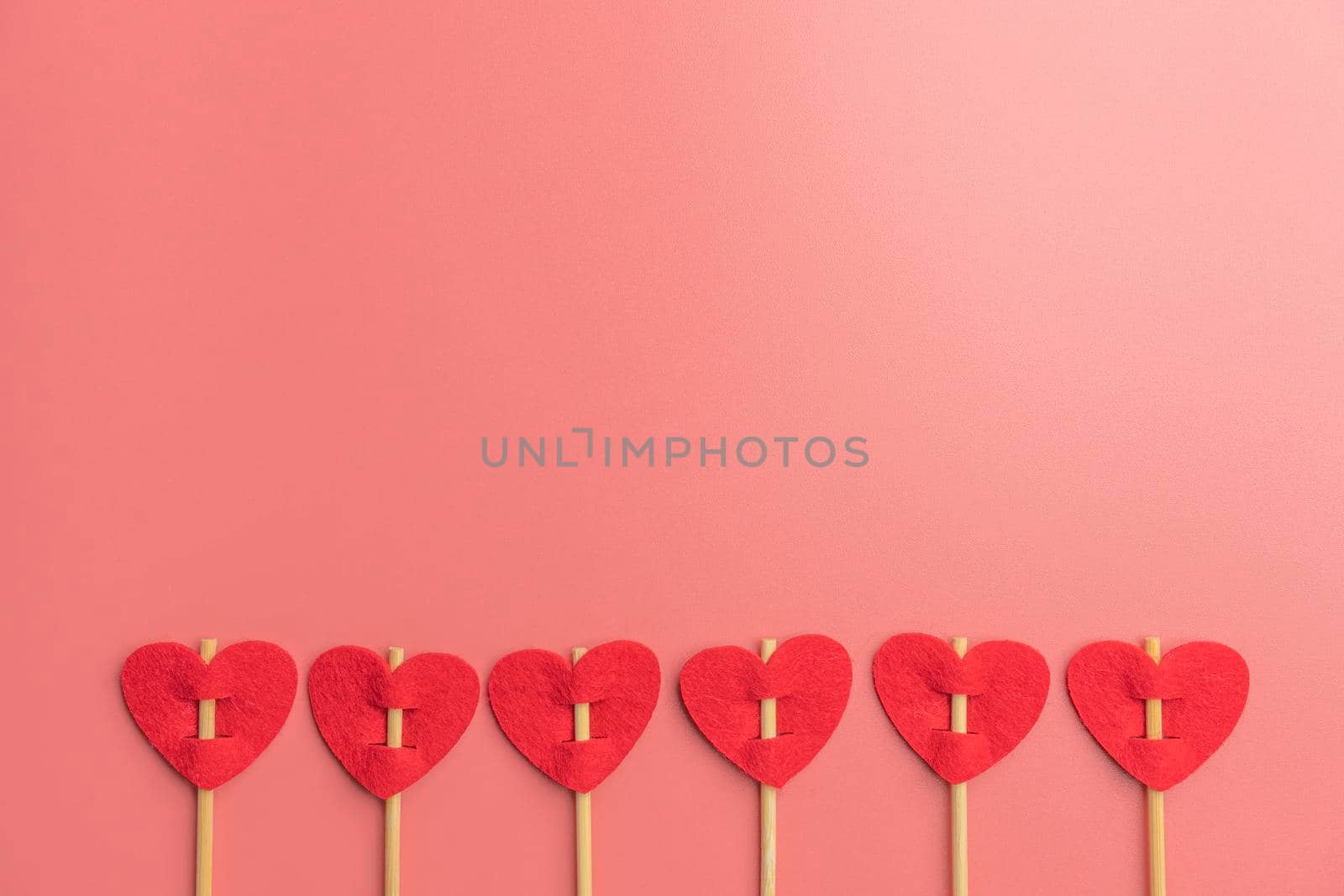 arrows with hearts on a pink background. the view from the top. High quality photo