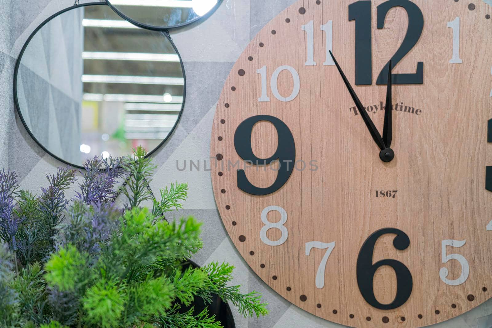 five minutes to twelve on the clock. spruce branches . mirror. hours. new year. Christmasive minutes to twelve on the clock. spruce branches . mirror. hours. new year. Christmas. High quality photo