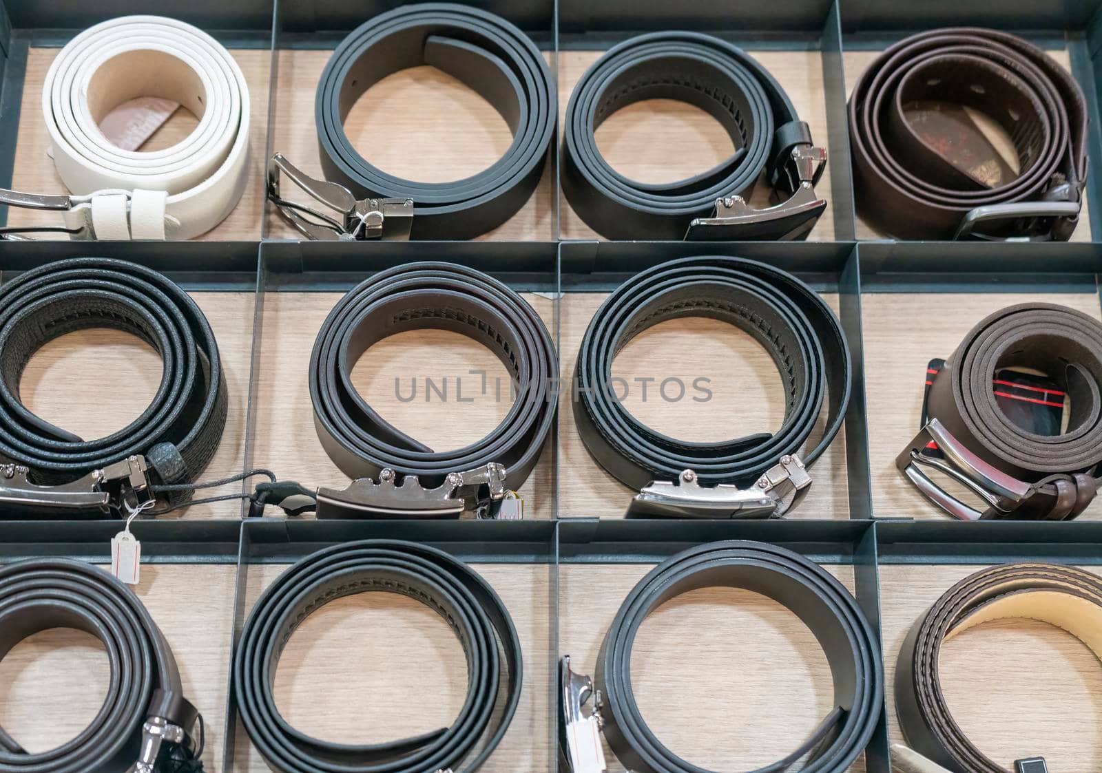 leather belts stacked in a row . the view from the top. High quality photo